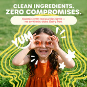 A smiling child outdoors on grass holding orange supplement pieces over their eyes, with large text reading 'CLEAN INGREDIENTS. ZERO COMPROMISES.