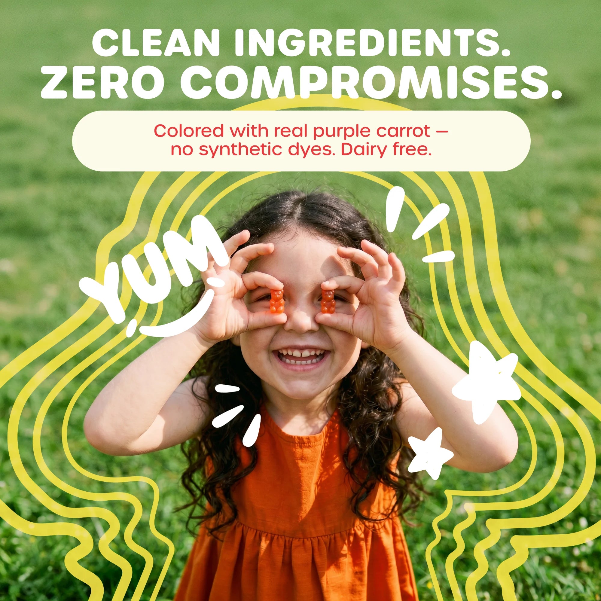 A smiling child outdoors on grass holding orange supplement pieces over their eyes, with large text reading 'CLEAN INGREDIENTS. ZERO COMPROMISES.