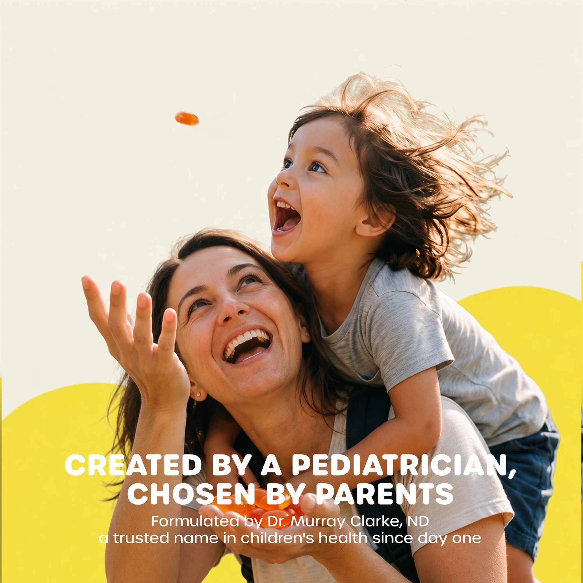 A smiling woman carrying a young child on her shoulders outdoors with text Created by a Pediatrician, Chosen by Parents